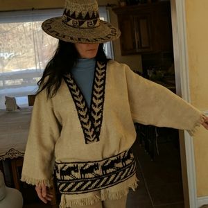 Wool poncho with knitted trim